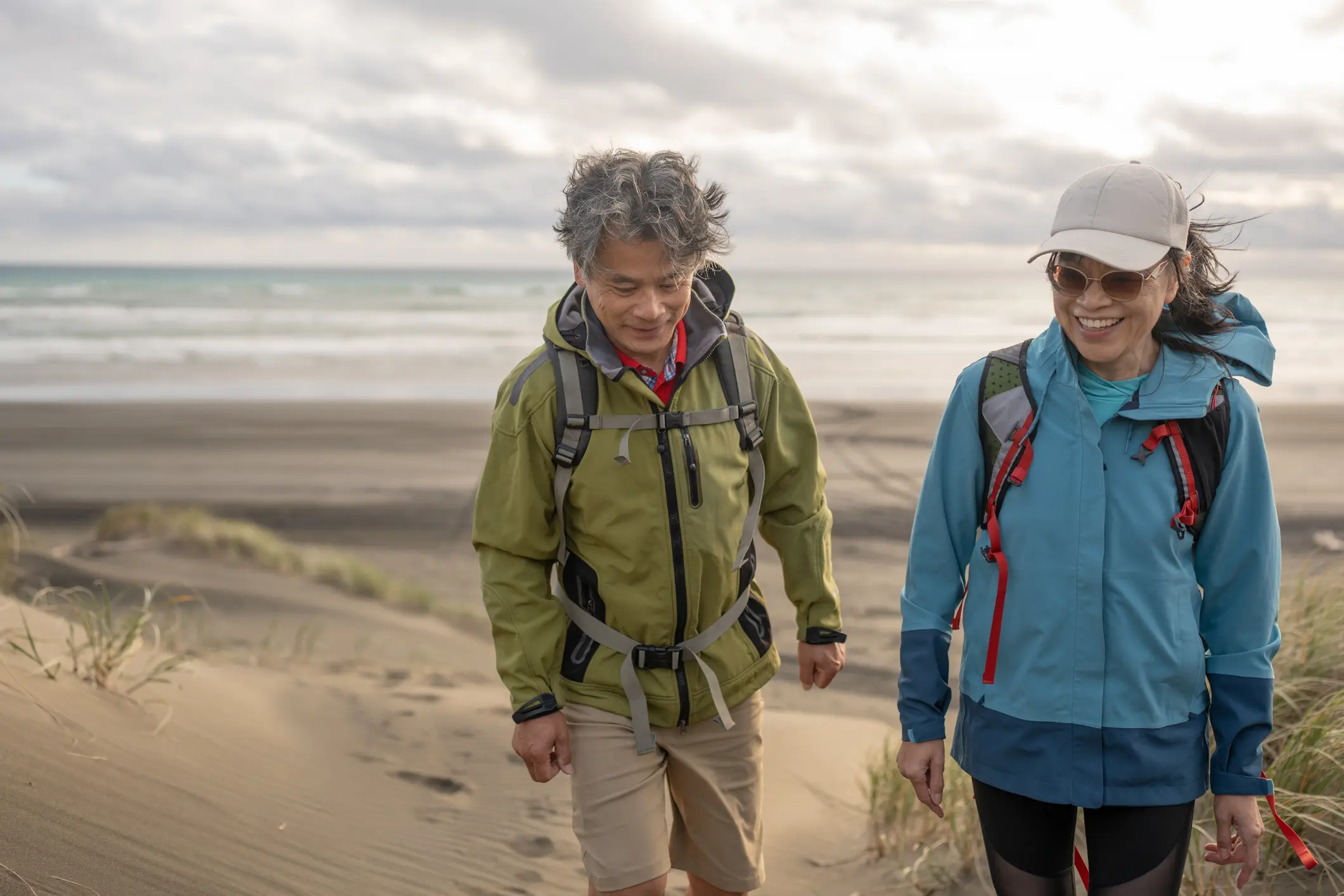 Two people hiking outdoors, illustrating a healthy lifestyle and active engagement.