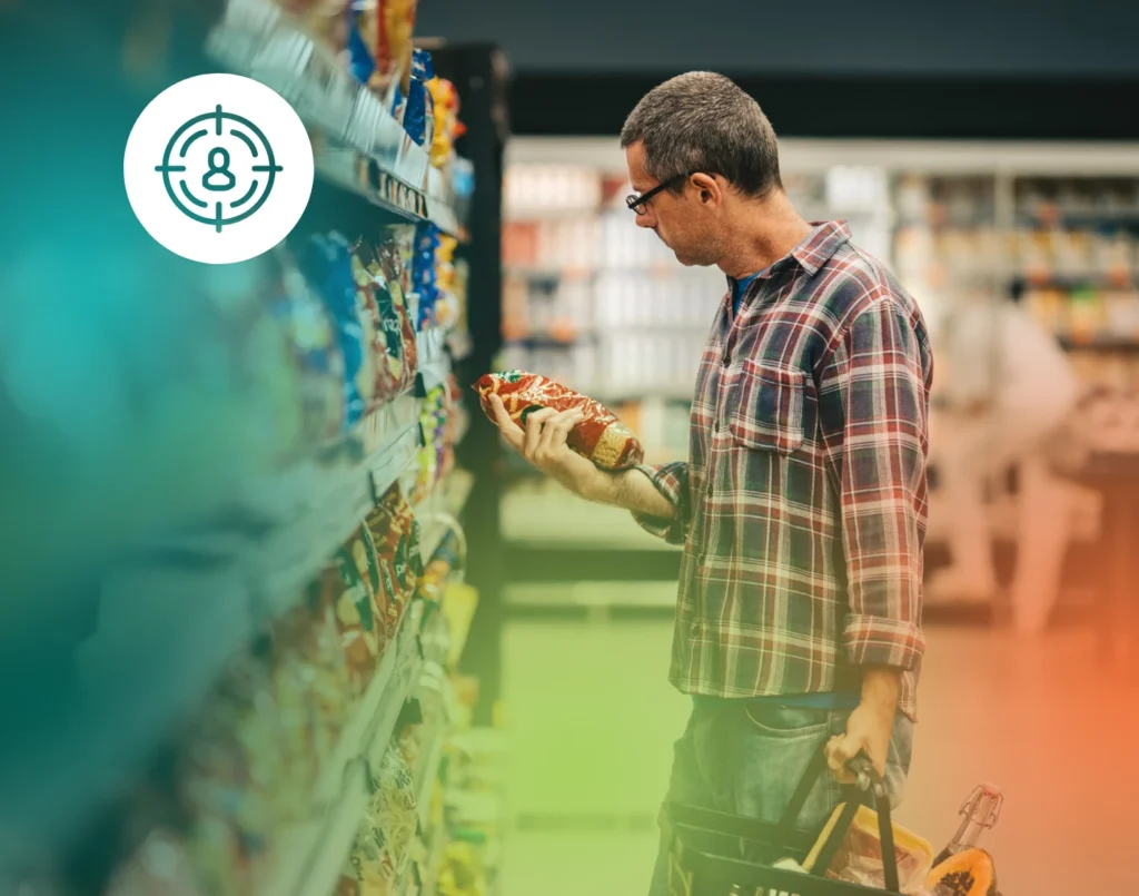 Man in grocery store examining medical device packaging, illustrating targeted marketing and audience personas.
